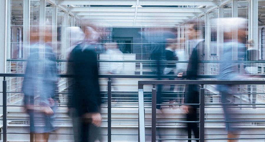 business-people-talking-in-corridor-PSVCLEM(1)